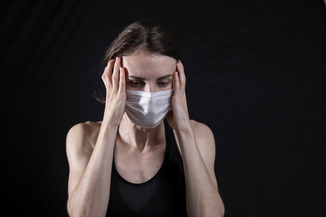 woman stressed with a mask